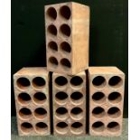 A set of four terracotta eight bottle wine-cellar racks, each measuring 45cm high x 22.5cm x 22.5cm,
