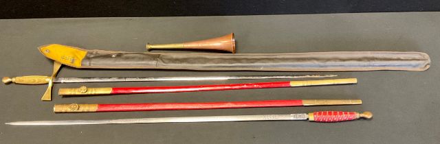 A Masonic dress sword, unsigned blade, brass hilt and cross guard, red painted scabbard, 85.5cm long