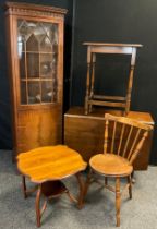 A reproduction mahogany narrow bookcase cabinet, 178cm high x 60cm wide; mahogany drop-leaf dining