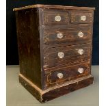 A miniature painted pine chest of drawers, with two short over three long graduated drawers, deep