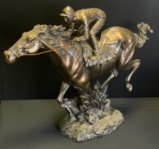 A Fairestware Academy bronzed resin sculpture of a Racehorse and Jockey Galloping, impressed