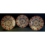 Royal Crown Derby - three 1128 Imari 26.5cm diameter dinner plates, all firsts, printed marks (3)