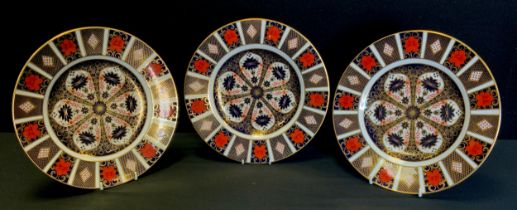 Royal Crown Derby - three 1128 Imari 26.5cm diameter dinner plates, all firsts, printed marks (3)