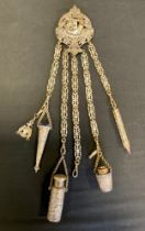 A 19th century silver plated chatelaine, five ornate suspension chains terminating with scissor