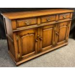 A Titchmarsh and Goodwin sideboard or dresser base, model number RL19855, having three short drawers