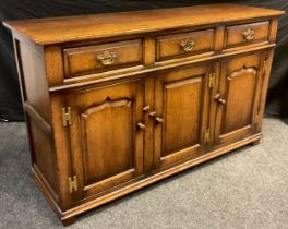 A Titchmarsh and Goodwin sideboard or dresser base, model number RL19855, having three short drawers