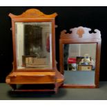 A late 19th century Mahogany framed hall mirror, shaped frame, bevelled plate, above a full length