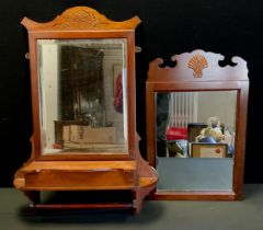 A late 19th century Mahogany framed hall mirror, shaped frame, bevelled plate, above a full length