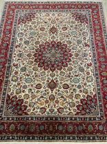 A large Persian Hamadan rug / carpet, knotted with central lotus-shape medallion, within a field