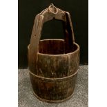 An Asian rice pail or feeder bucket, iron foot sand fittings, ring top loop, approx 60cm high