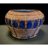 A large Chinese/Tibetan wicker bound jardinière/planter, mottled tone of blue with intricate