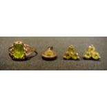 A Peridot jewellery suit, oval ring, pendant, 9ct gold mounts, 4.3g gross; pair of three stone