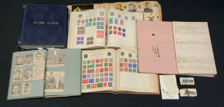 A Victorian scrap album of greeting cards, cut papers sections, portraits, etc, three stamp albums