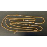 A fancy 9ct gold ring ball and bar link guard chain, stamped 9ct, 132cm long, 18.1g