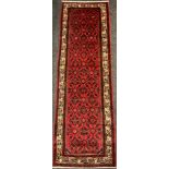 A North West Persian Malayer runner, the hand-knotted field with all-over design of repeating