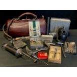 A vintage Doctors/Dentist bag with contents of assorted medical instruments and tools inc