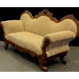 A Victorian Louis XV revival walnut sofa, serpentine-shaped back, rococo carved c-scrolls and