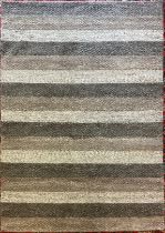 A Catherine Carnaby hand made Varied Stripe Coast pattern wool rug, approx. 160cm x 230cm