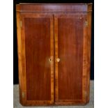 A 19th century crossband mahogany corner cupboard, satinwood stringing. 105cm high x 72cm wide x