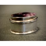 A Derbyshire blue john inset 925 silver oval pill box, strong purple tones, stamped 925, 4cm long,