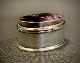 A Derbyshire blue john inset 925 silver oval pill box, strong purple tones, stamped 925, 4cm long,