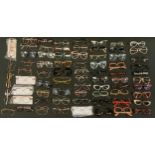 A large quantity of Ophthalmic spectacle frames including; Christian Dior, Converse and Playboy;