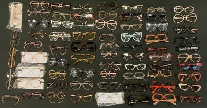 A large quantity of Ophthalmic spectacle frames including; Christian Dior, Converse and Playboy;