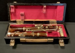 A late 19th/early 20th century rosewood clarinet, unnamed, cased