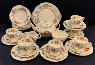 A Crescent ware tea service for six including; a tea pot, milk jug, sugar bowl, six tea cups and