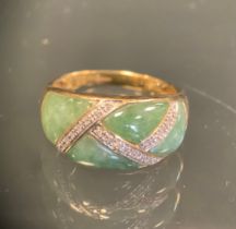 A diamond and green stone Onyx panels ring, lattice set with diamond accents, 9ct gold shank, size