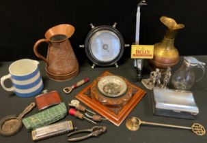 A 20th century aneroid barometer, carved square back; another as a ships wheel, Advertising bottle