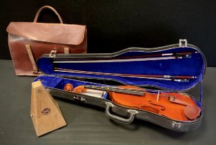 A Stentor Student’s 4/4 violin, cased with bow en-suite; a Jaccard metronome, sheet music bag, (3).