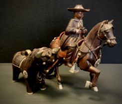 A Peruvian Fernando Castro silver mounted figure, child riding a Goucho style horse, stamped with