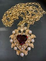 A garnet and seed pearl heart pendant necklace, 9ct gold mount and chain, 49cm long, 11.4g gross