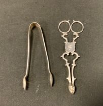 A pair of 19th century silver scissor action sugar tongs, marks worn, c.1820, others later, 1.78ozt,