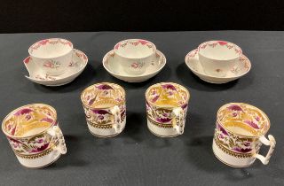 A trio of 18th century New Hall tea bowls and saucers, painted with floral swags and pink scales,