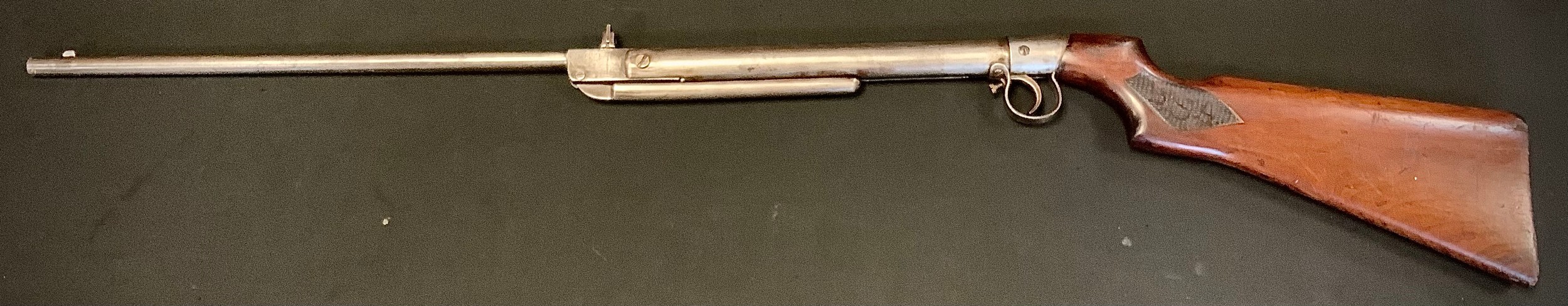 An early 20th century BSA air rifle, .177 calibre, underlever action, walnut stock with chequered