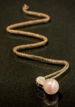 A diamond and cultured pearl necklace, inverted pear shaped diamond accented cluster of nine round