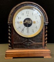 An Edwardian/early 20th century oak cased Bulle patent early electric domed mantel clock