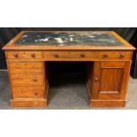 A Victorian mahogany pedestal desk, inset leather top, single long, and two short drawers to frieze,