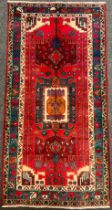 A North West Persian Nahawand rug / carpet, in rich colours, red, green, blue, and cream, 230cm x