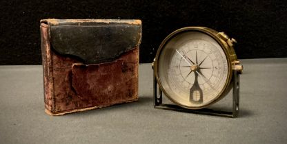 An early 20th century brass compass on adjustable stand, in leather case