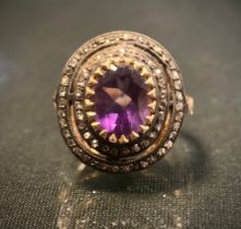 A 19th century style rose cut diamond and amethyst cluster ring, central oval pale purple amethyst