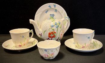 A Beswick duet tea set, relief decorated in the Wayside floral design, c.1920 inc 871 shape