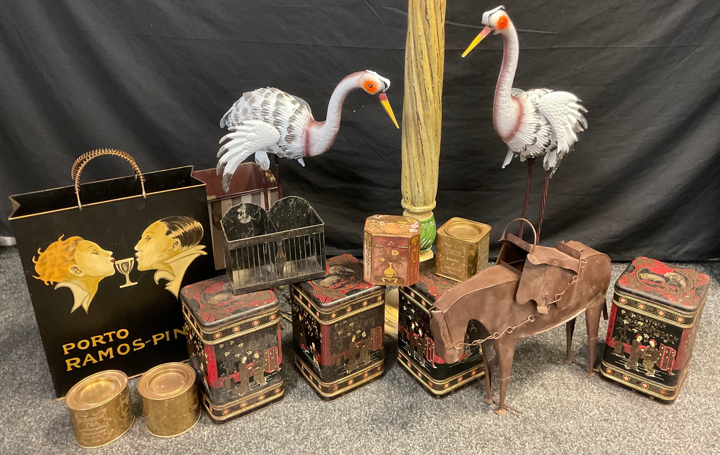 Collector’s tins and metal ware - four Chinoiserie loose tea tins; a pair of metal-work garden Stork