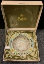 A Belleek woven basket porcelain bowl, boxed.