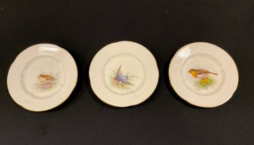 A pair of Royal Worcester quarter lobbed miniature cabinet plates, painted with a Swallow resting on