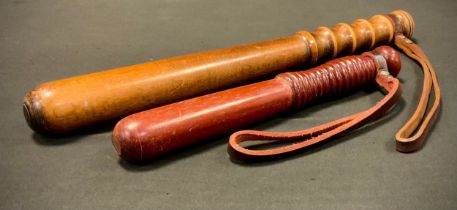 Police Interest - a 1970s turned wooden truncheon, 40cm long, another smaller possibly a Detectives,