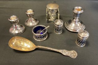 A three piece silver and blue glass condiment set, Birmingham 1942; silver topped glass inkwell,