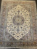 A large Kashan carpet, central floral medallion field, within multi section border, the whole in